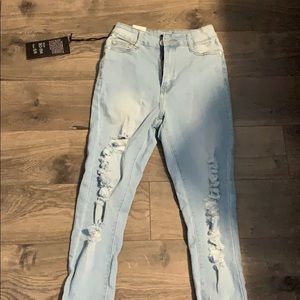 Blue distressed skinny jeans.